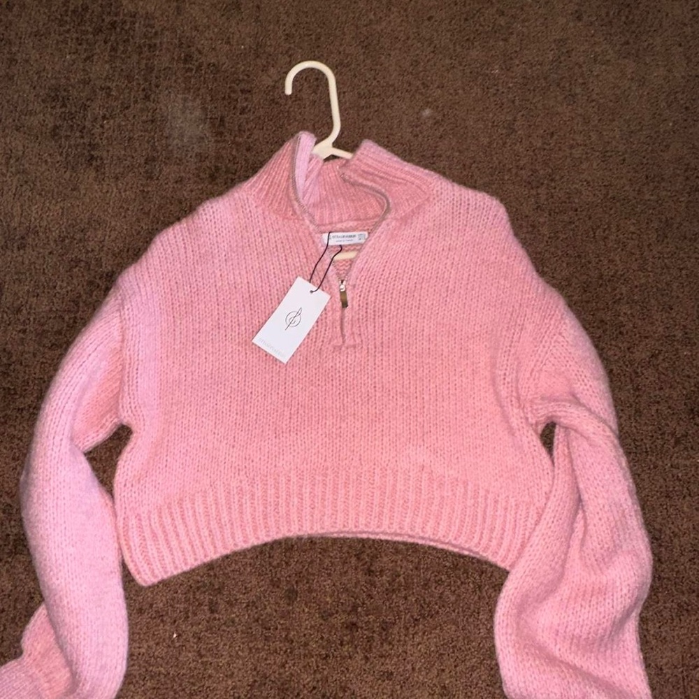 Cut pink knit sweater